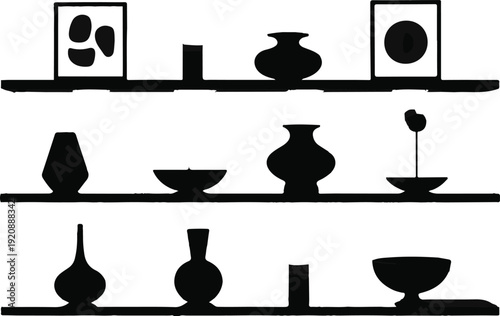 Minimalist shelf display silhouette containing various ceramic vases bowls and framed abstract art