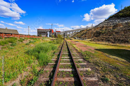Canvas Print Train track passing under the ore conveyor and the tipple of the Atlas Coal Mine