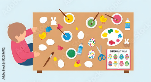 Top view of child painting Easter eggs and crafts