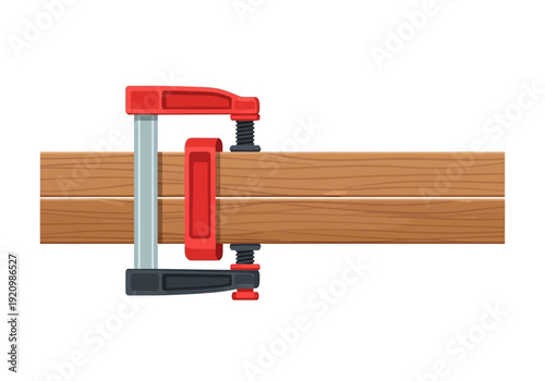 A clamp holding wooden planks together during a woodworking process viewed from the side