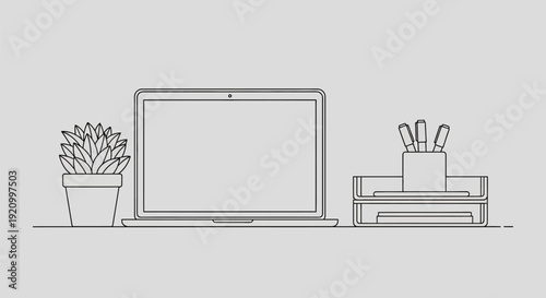 Laptop Computer with Office Supplies Nearby.