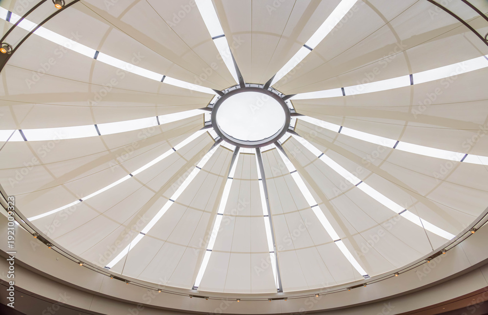 Naklejka premium Modern architectural dome with radial light panels and central skyligh