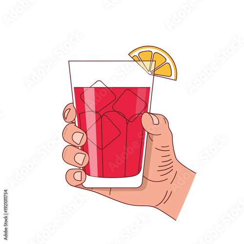 Hand holding glass with red drink.