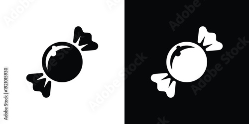 Black and white wrapped candies on split background