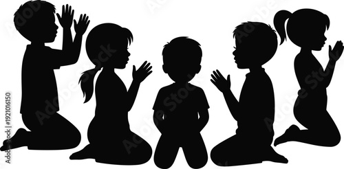 Black silhouette collection of young children kneeling and praying together for religious faith spiritual devotion hope peace and Christian worship.