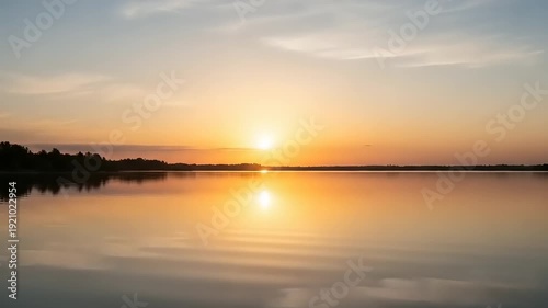 Serene Lake Sunset with Calm Water Reflection.