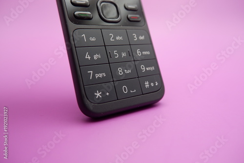 Feature Phone Keypad Detail Isolated on Purple Surface