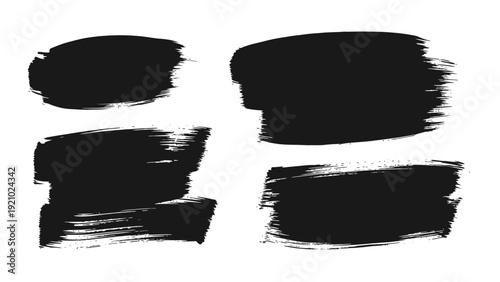 Set of Four Black Brush Stroke Textures on White Background.