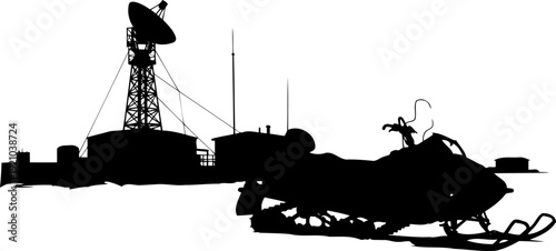 Arctic snowmobile silhouette parked near a polar research station