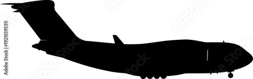 Large military cargo aircraft flying in profile