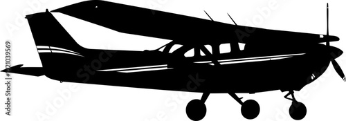 Light propeller aircraft silhouette parked on a flat surface