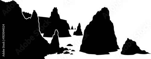 Coastal sea stacks silhouette rising from the ocean water