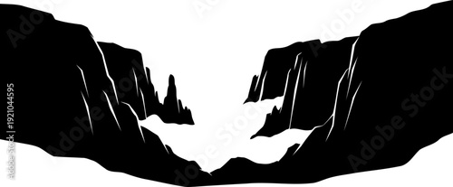 Dark silhouette of a deep canyon with jagged rock formations