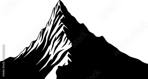 Sharp mountain peak silhouette rising in alpine landscape