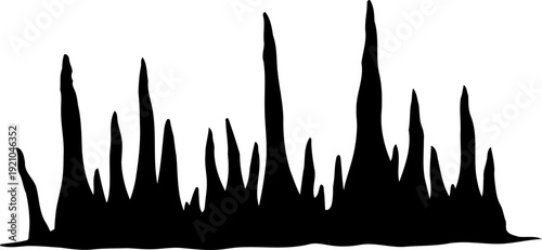 Sharp rock formations or stalagmites silhouette