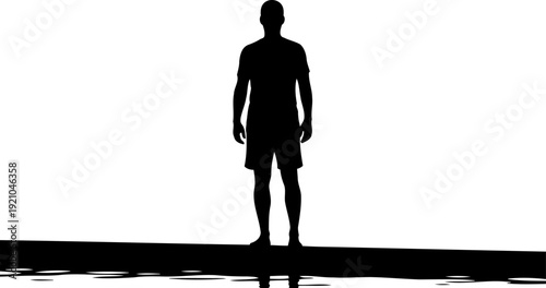 Silhouette of a man standing on a pier overlooking calm water
