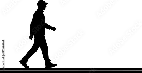 Side view silhouette of a man walking in a casual stride