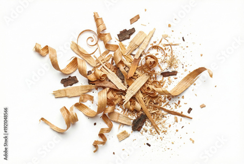 Pile of light brown wood shavings, chips, and bark fragments scattered on a clean white background, viewed from directly above.