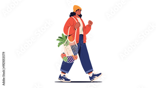 Young woman in an orange jacket and beanie walking with a net grocery bag filled with fresh vegetables on a white background.