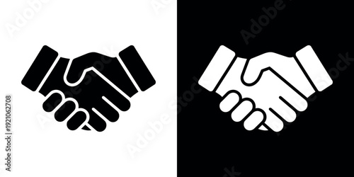 Black and white handshake on split background business 2