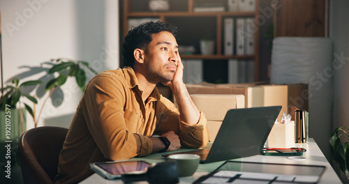 Fotografi Laptop, logistics and thinking with man in office for delivery, distribution or shipping of boxes