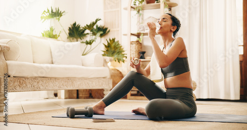Tableau sur toile Break, drinking water and yoga with woman in living room of home for holistic wellness or hydration