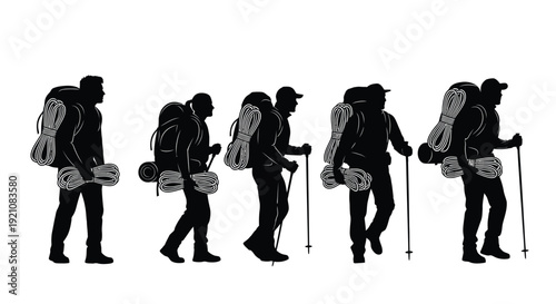 Silhouettes of hikers walking in a line carrying ropes and backpacks