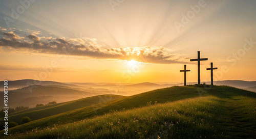 Three crosses on a hill at sunset with a serene landscape and vibrant sky