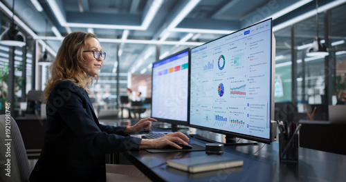 Photos Compliance Officer Monitors Business Security Regulations With Dashboard