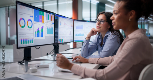 Diverse Women On Analytics Team Analyzing Financial Data