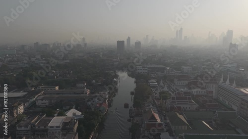 Aerial view morning sunrise with fog river rural village with modern office building background Bangkok Thailand