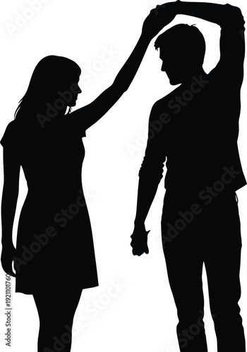 Silhouette of a woman playfully touching a mans head