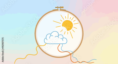An embroidery hoop with a stitched design of a sun and cloud, with colorful threads trailing out.
