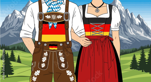 Couple in traditional German attire standing in front of mountains
