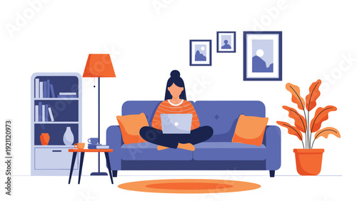 Young woman works comfortably from home on her laptop while sitting on a blue sofa in a stylishly decorated room.