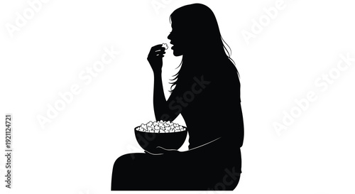 A dark silhouette of a woman enjoying a bowl of food possibly breakfast with a simple profile silhouette