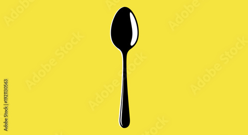 Black Spoon Isolated on Yellow Background.