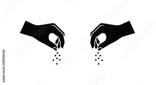 Hands holding seeds with falling granules a stark silhouette