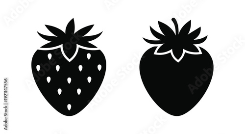 Two black strawberry shapes are displayed as a striking silhouette