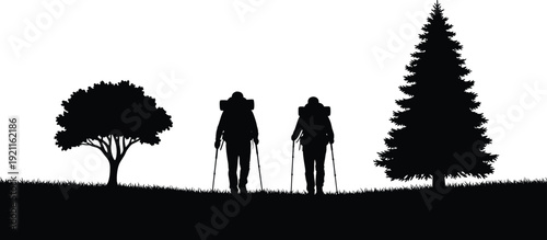 Two Hikers Walking with Backpacks and Trekking Poles in a Forest with Trees Silhouette