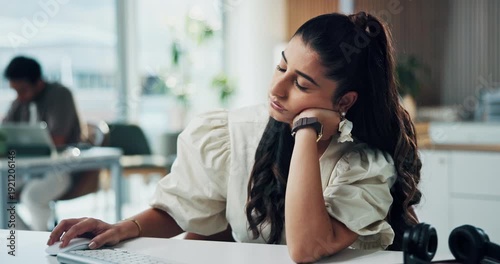 Tired, woman and bored with computer in office for burnout, sleepy and low energy for submission. Coworking agency, exhausted journalist and lazy at tech from insomnia, tedious article and overworked