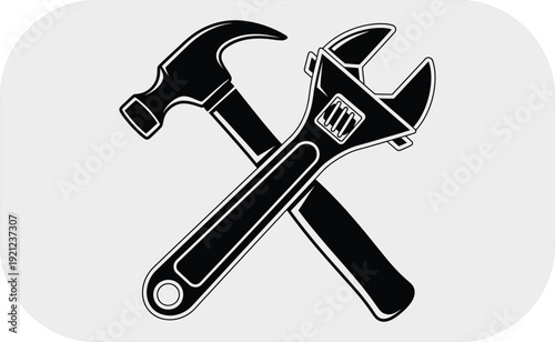 Crossed wrench and hammer tools
