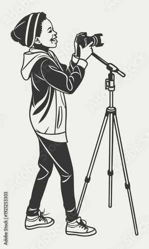 Young photographer capturing moments with a camera on a tripod.