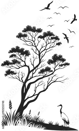 Silhouette of a tree with flying birds and a crane standing on the ground.