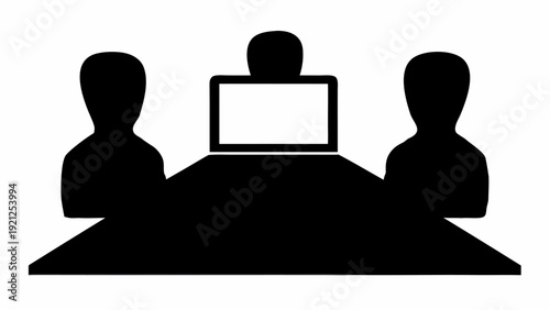 Business team meeting around conference table with laptop