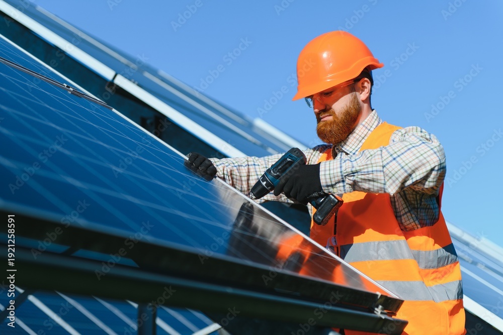 Fototapeta premium Skilled technician installing solar panels for green energy