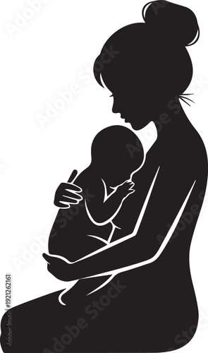 Silhouette of a mother holding her baby in her arms
