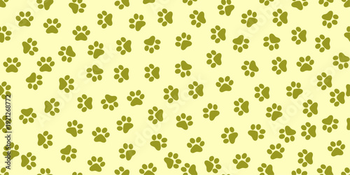 A playful pattern of green paw prints on a pale yellow background.