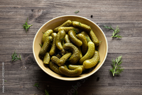 Wallpaper Mural Pickled cucumbers in bowl on wooden background Torontodigital.ca