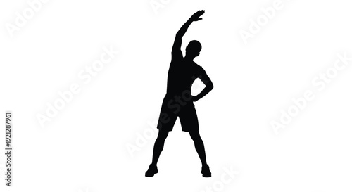A person stretching their arm captured in stark black silhouette